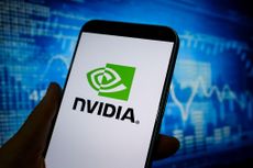 logo of Nvidia is displayed on smartphone screen with price charts in the background