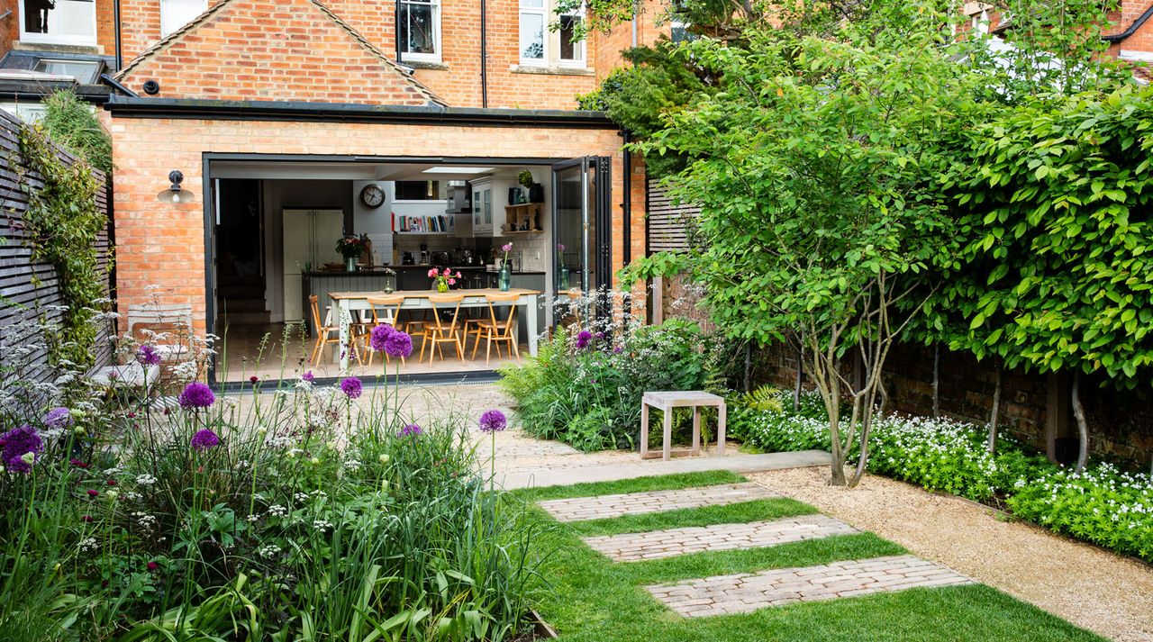 Garden with paving stones and wild plants