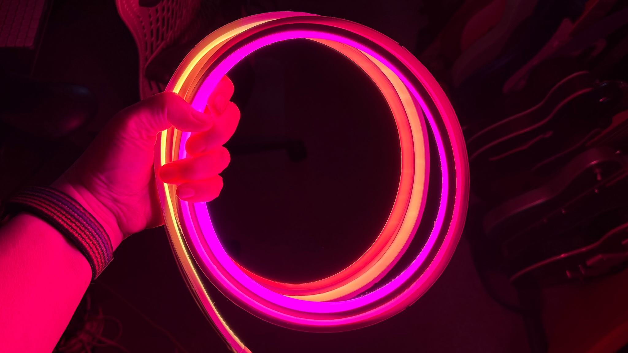 Hue Omniglow lightstrip held in a hand
