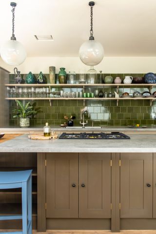 Brown kitchen with glossy green kitchen tiles