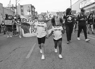 Marchers at a Black and Brown Unity rally in Chicago, June 2020