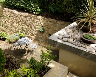 levelled garden with rocks and seating