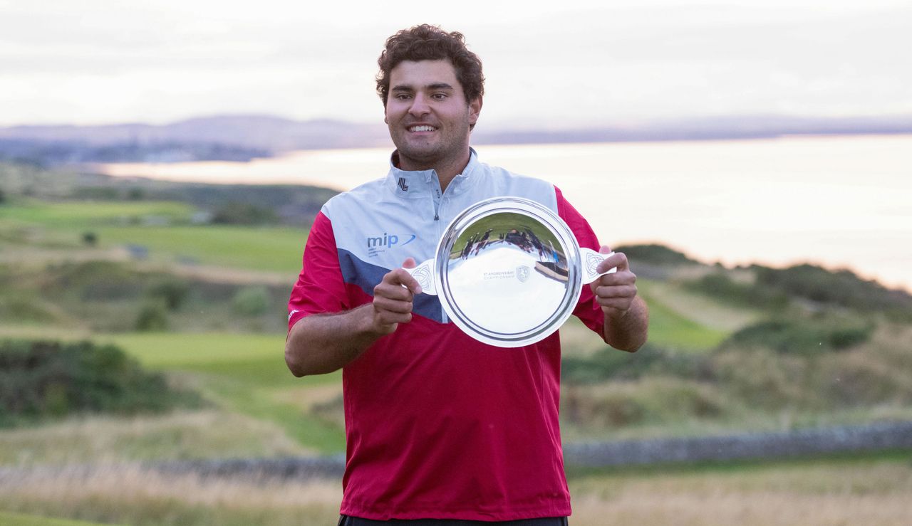 Chacarra poses with the trophy