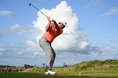 What is 'coil' in the golf swing?