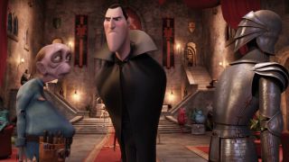 Drac stands annoyed between a zombie and a suit of armor in Hotel Transylvania.