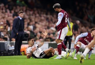 Aleksandar Mitrovic of Fulham is fouled by Douglas Luiz of Aston Villa leading to a red card decision during the Premier League match between Fulham FC and Aston Villa at Craven Cottage on October 20, 2022 in London, England. (Photo by Ryan Pierse/Getty Images)