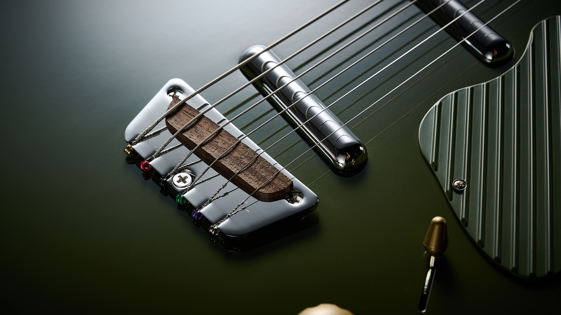 Close up of the bridge on a Danelectro Dan O Cool Baritone guitar