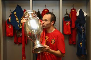 Andres Iniesta kisses the European Championship trophy after Spain's win over Italy in the final of Euro 2012.