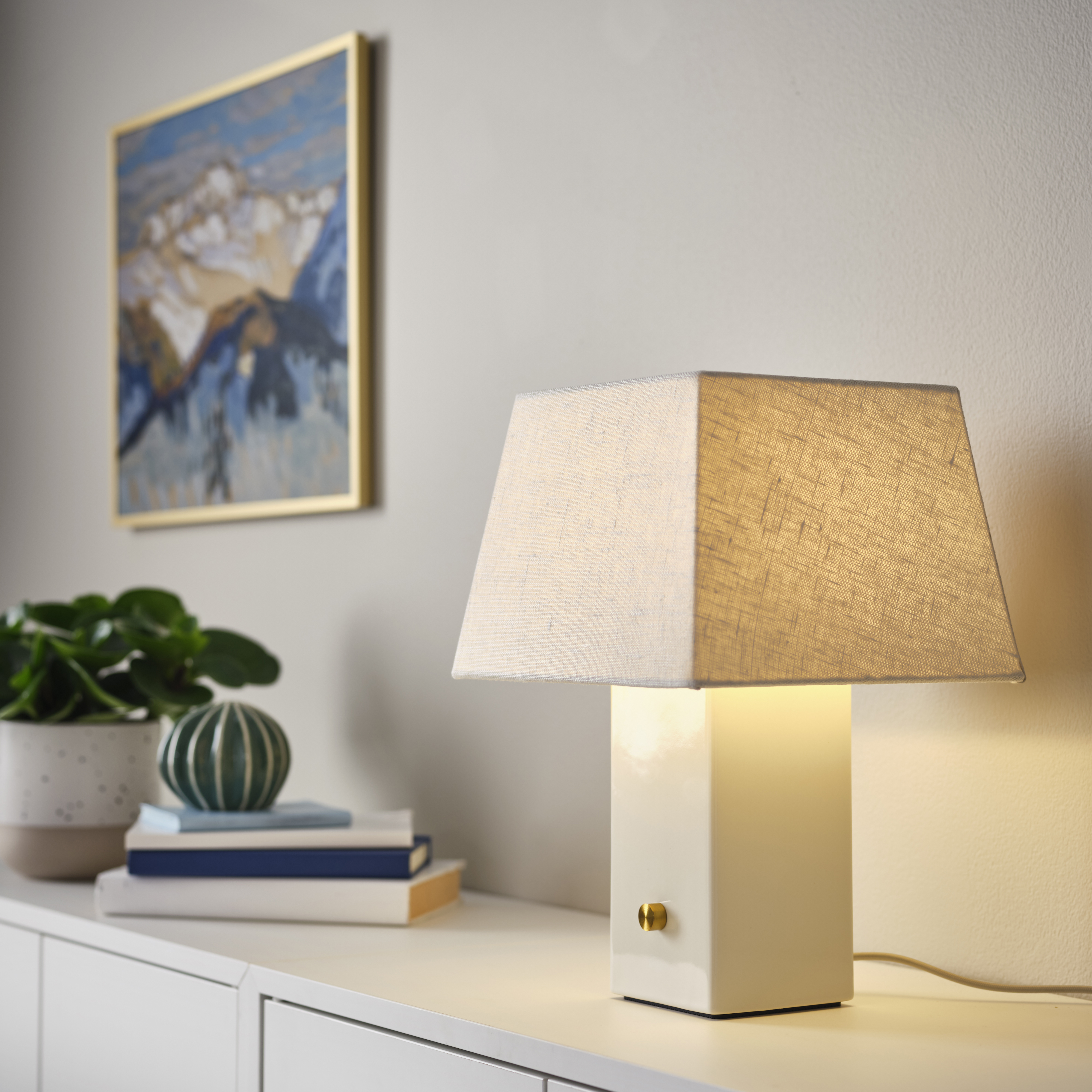 white linen lamp on a cabinet