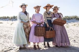 the march sisters standing on a sunny beach in dresses in greta gerwig's Little Women