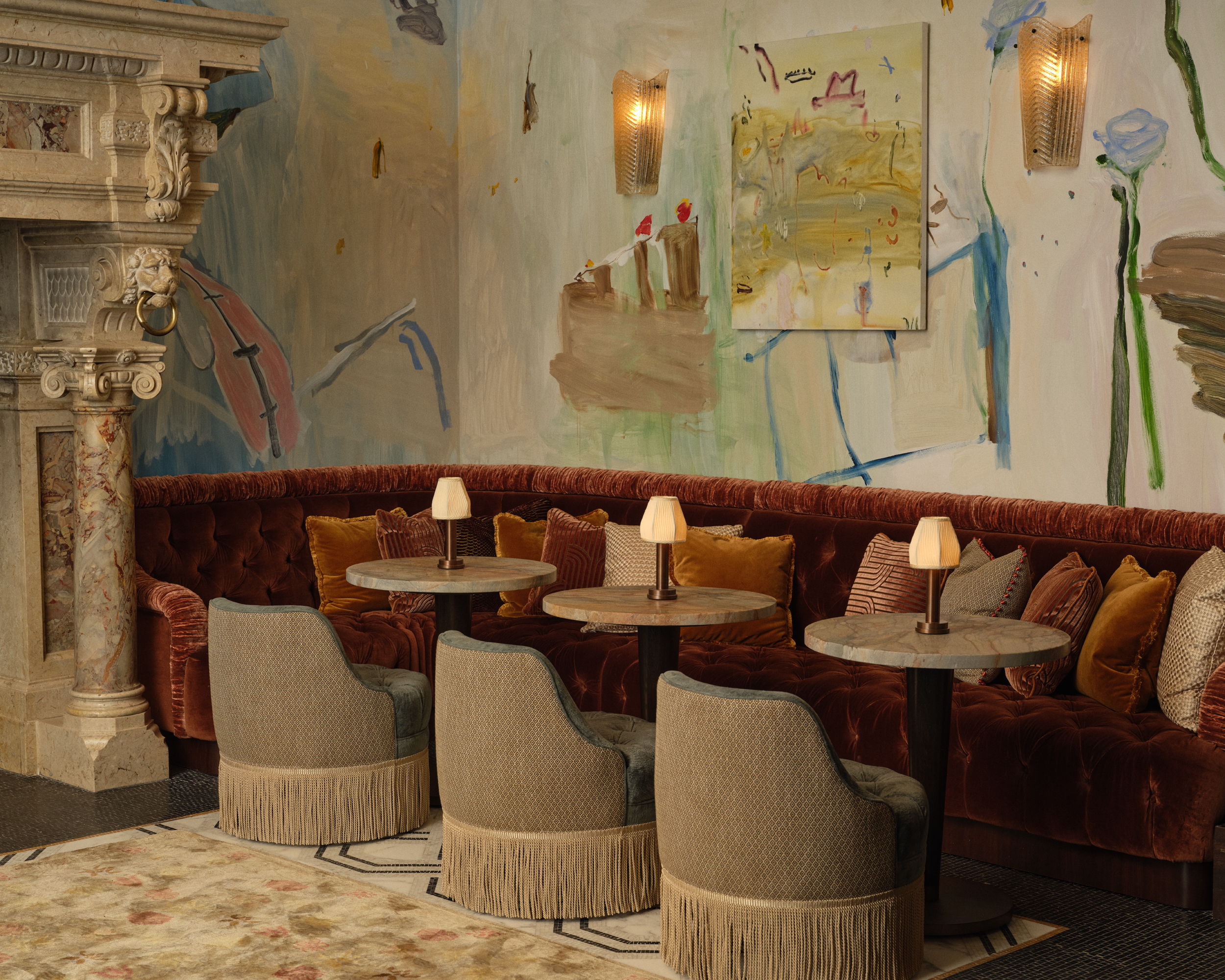 interior views of plush, warm and moodily lit at the Ned Noman hotel in New York