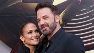 Jennifer Lopez smiling looking at Affleck at the premiere of The Flash 