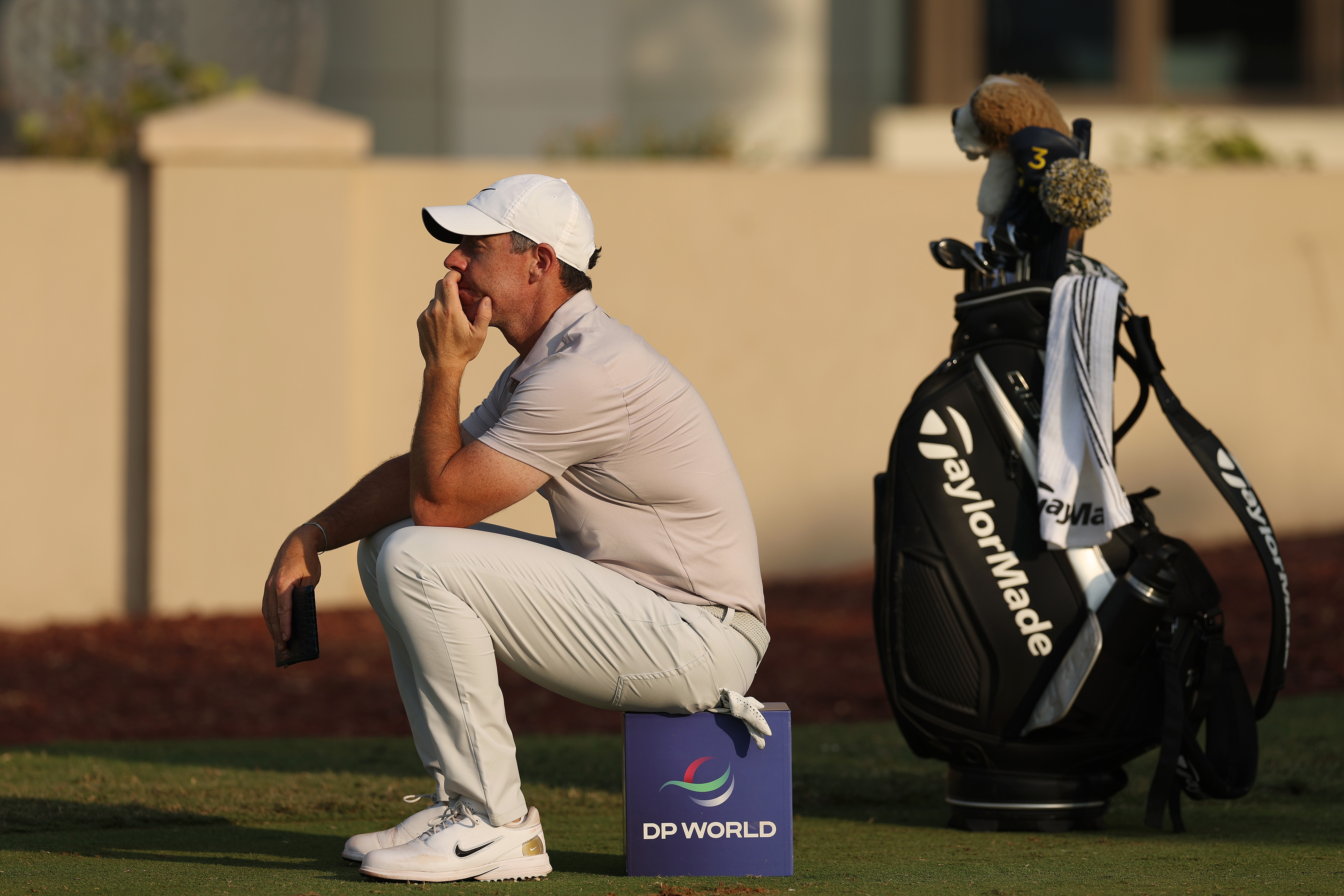 Rory McIlroy sits on a tee marker during the DP World Tour Championship