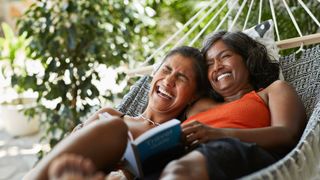 two women laughing together