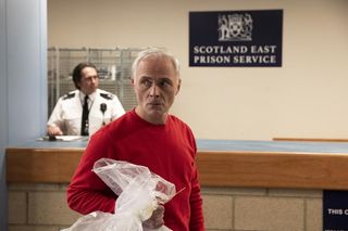 Max (Mark Bonnar) picking up his personal belongings as he leaves prison