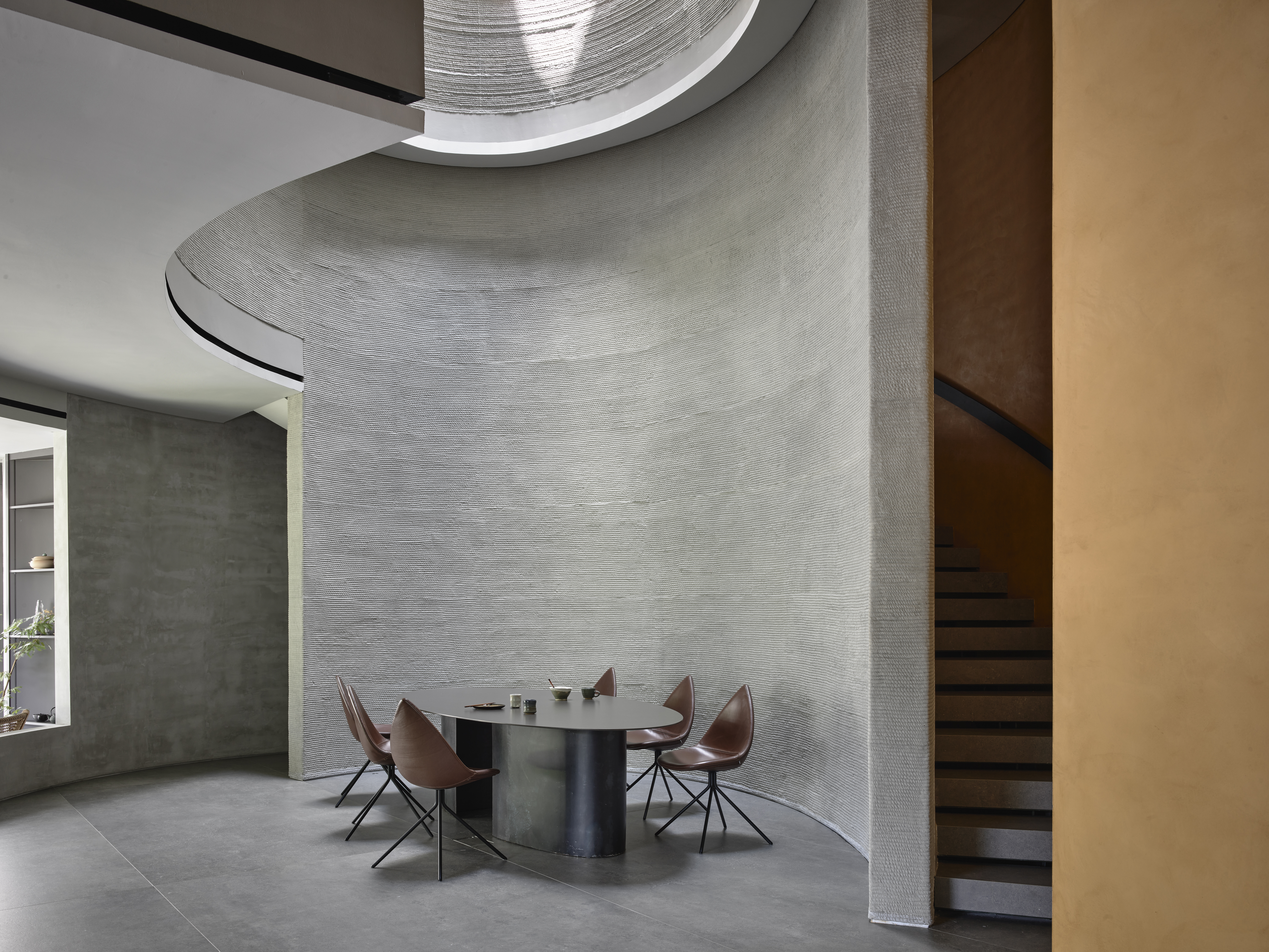 QR3D singapore 3d-printed concrete house interior with yellow wall and curves