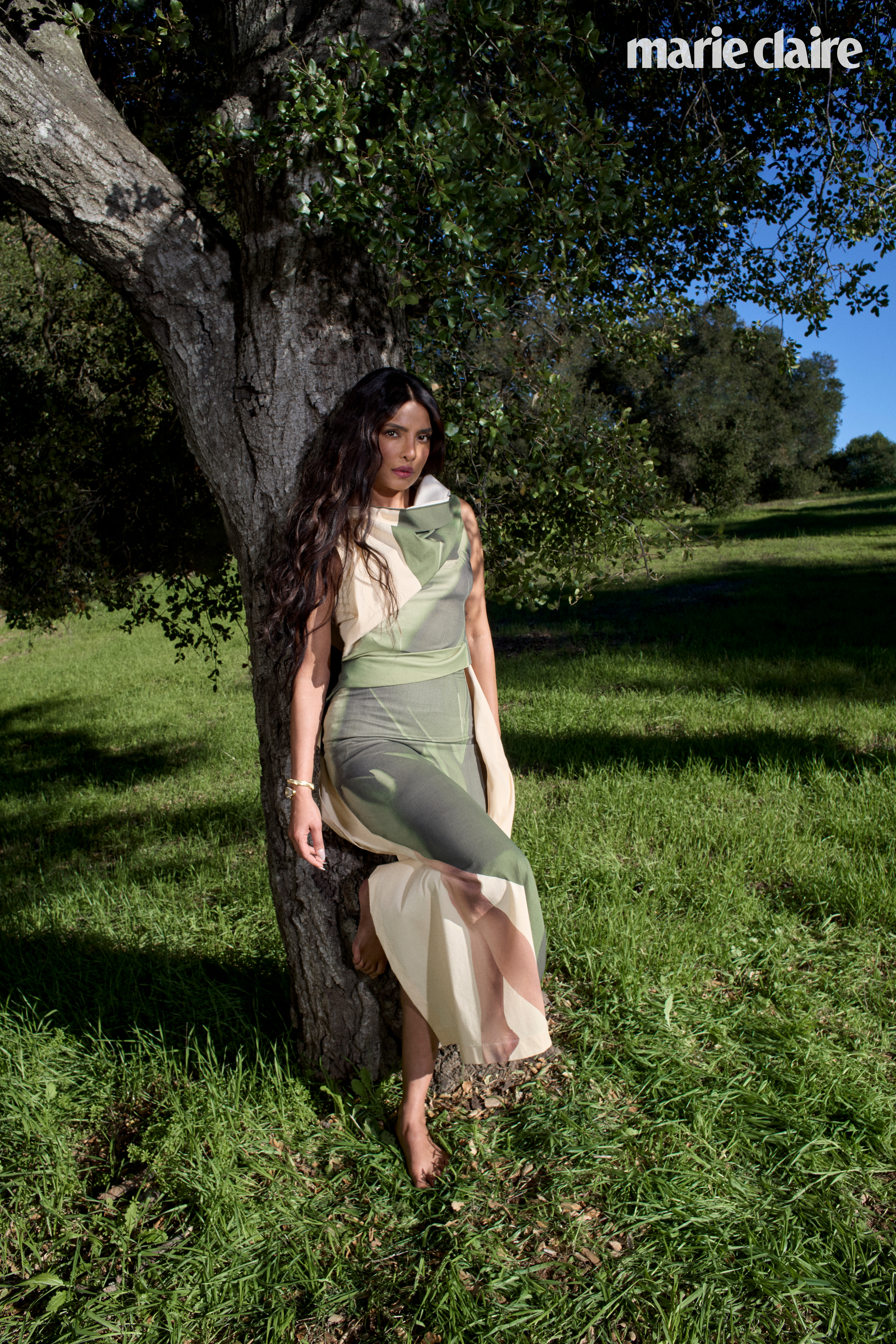 Priyanka Chopra Jonas leaning against a tree