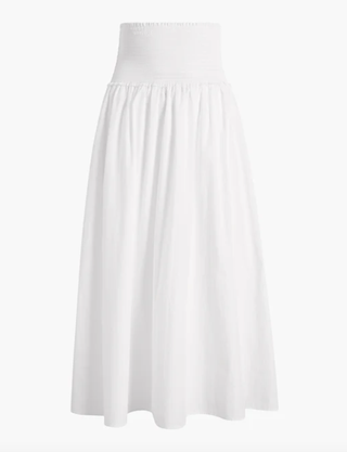 a white ruched skirt by Hill House Home in front of a plain backdrop