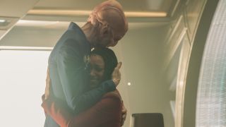 Doug Jones and Sonequa Martin-Green hugging on Discovery bridge set in series finale