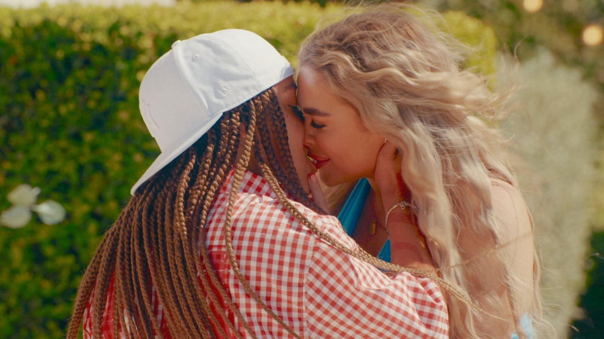 Contestants Ashlea and Imogen share a kiss on the British lesbian dating show 'I Kissed a Girl.'