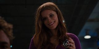 Kate Mara smiles as she looks at Robert Downey Jr. in a scene from Iron Man 2