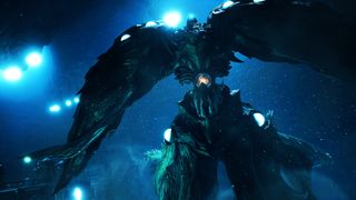 A towering green monster covered in orbs swimming under the sea hunting for its prey.