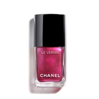 A product shot of Chanel le vernis nail colour in shade Charmer on a white background