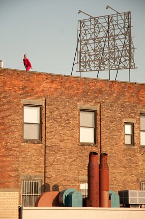 A single dancer on a rooftop