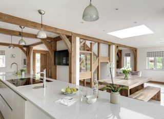 oak and glass staircase in a contemporary kitchen