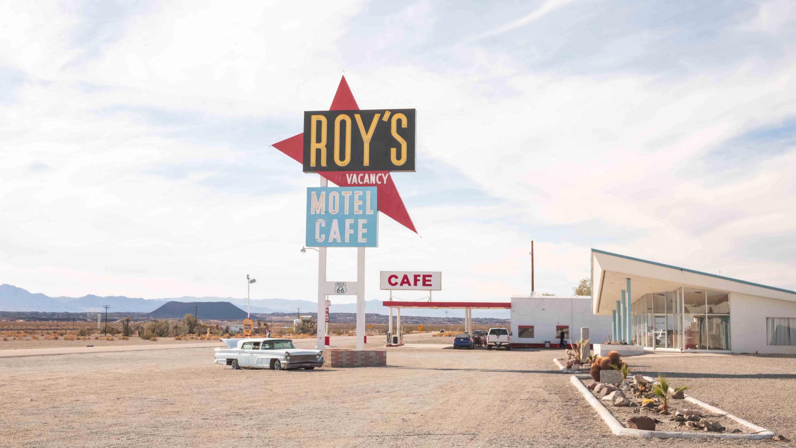 Retro-style photographs of the Route 66 road, motels and vintage vehicles 