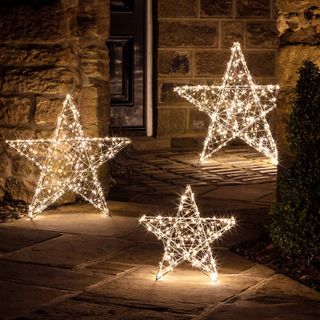 light up stars in a garden for Christmas