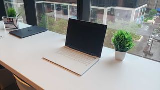 white laptop on table