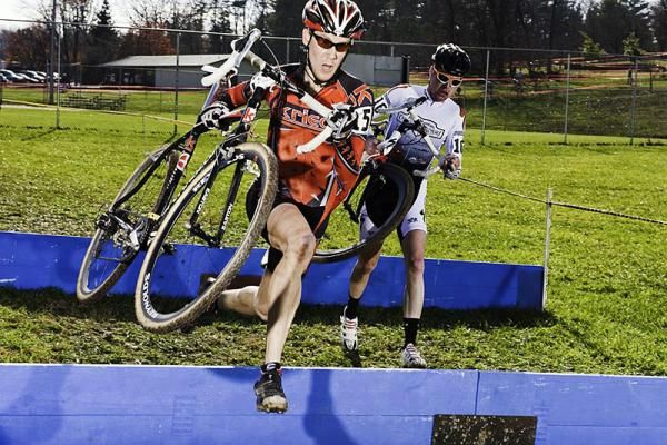 Sam Krieg (Ice Krieg Cycling), left, leads Grant Berry (Rocky Mountain Chocolate Factory) through the barriers.