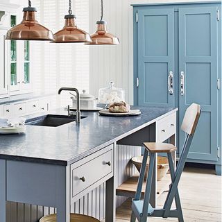 kitchen with white wall and wooden flooring