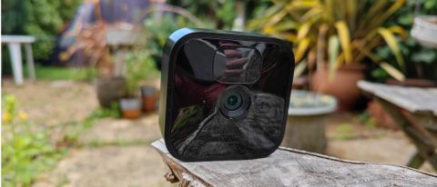 The Blink Outdoor security camera in a garden