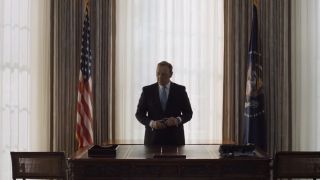 Frank Underwood standing behind a desk in the Oval Office