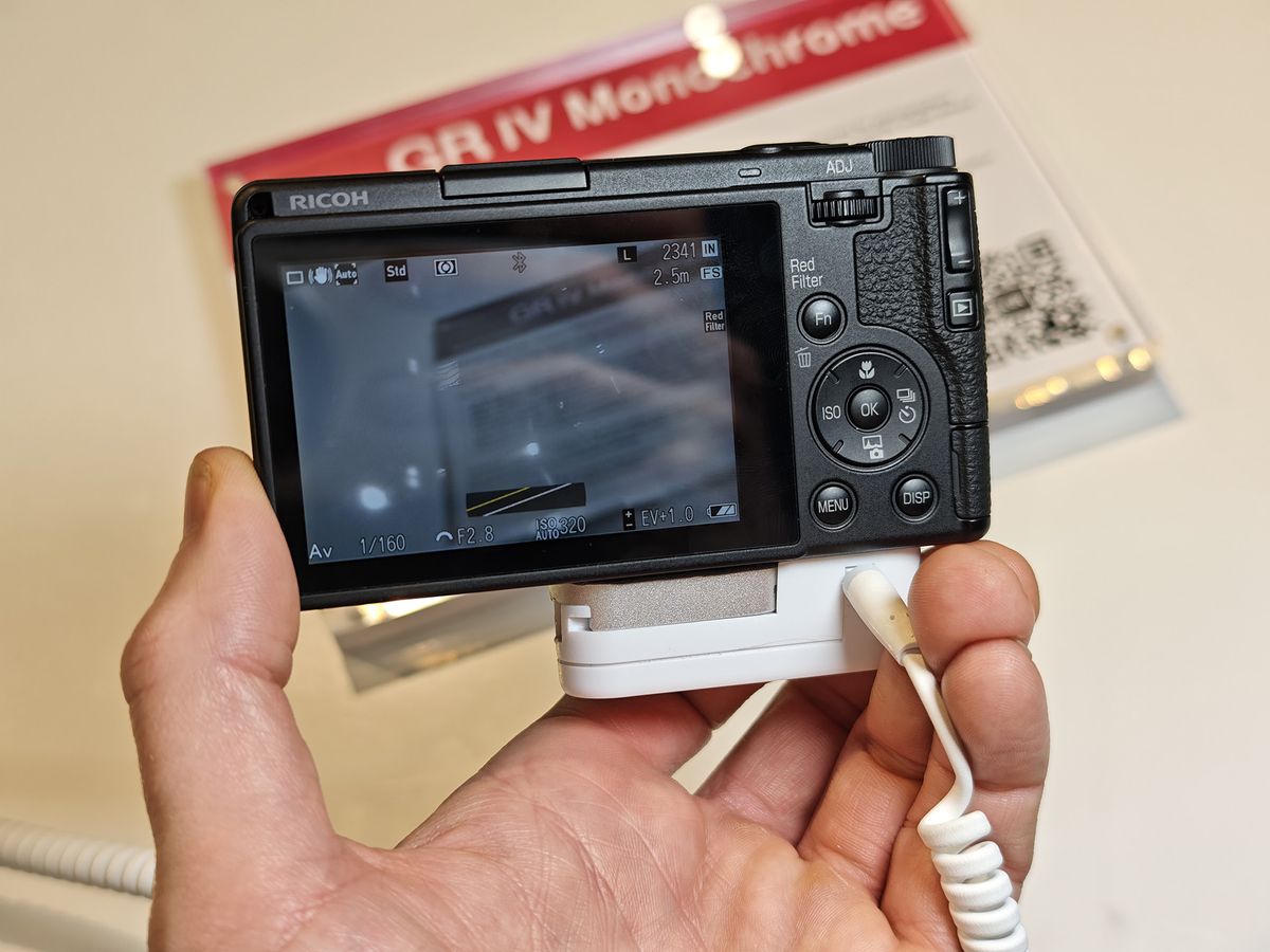 Ricoh GR IV Monochrome in the hand, at the Ricoh stand at The Photography Show 2026