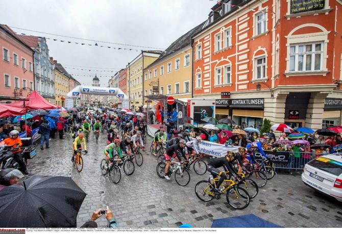 The riders roll out after the start