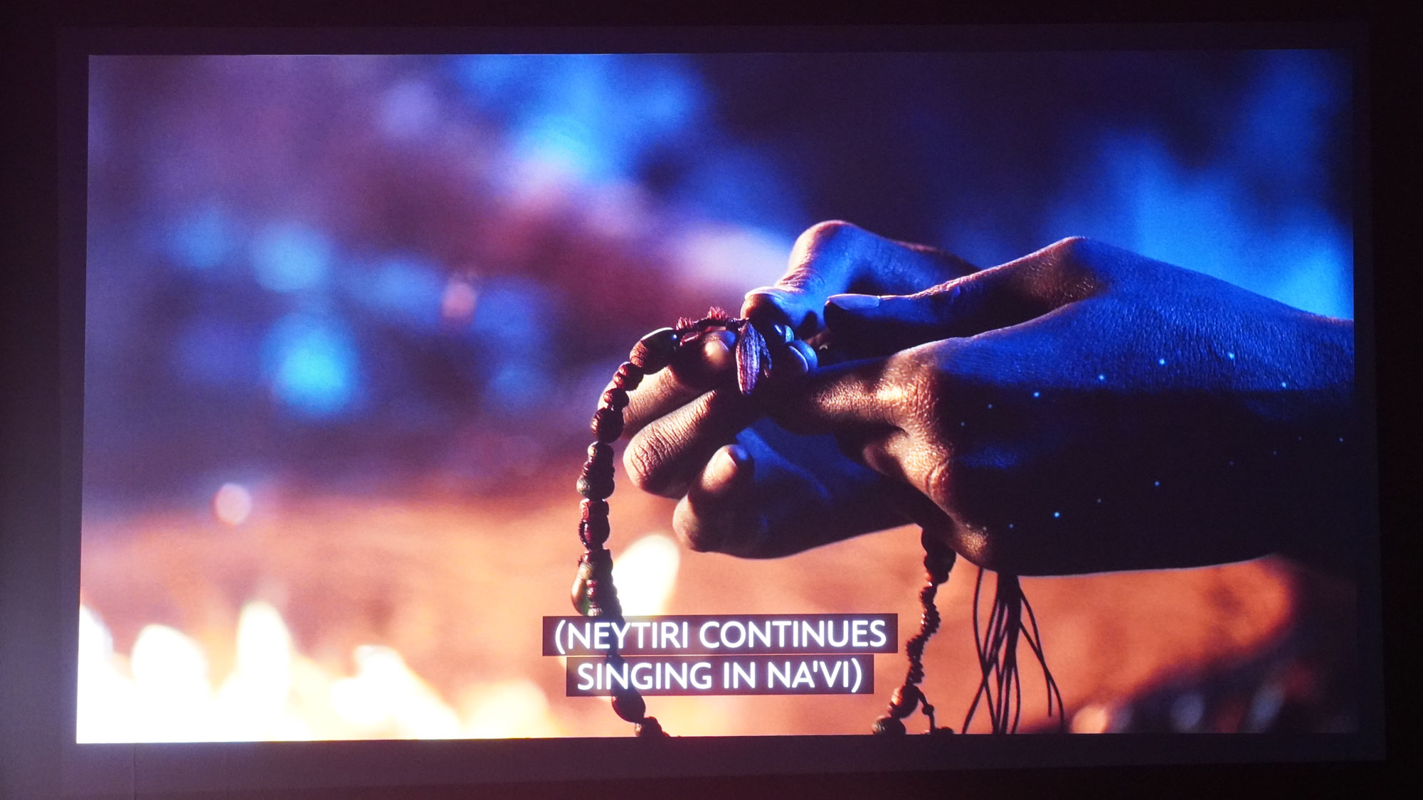 The projection from a JMGO N1S Ultimate projector displaying a high contrast scene from Avatar: The Way of Water.