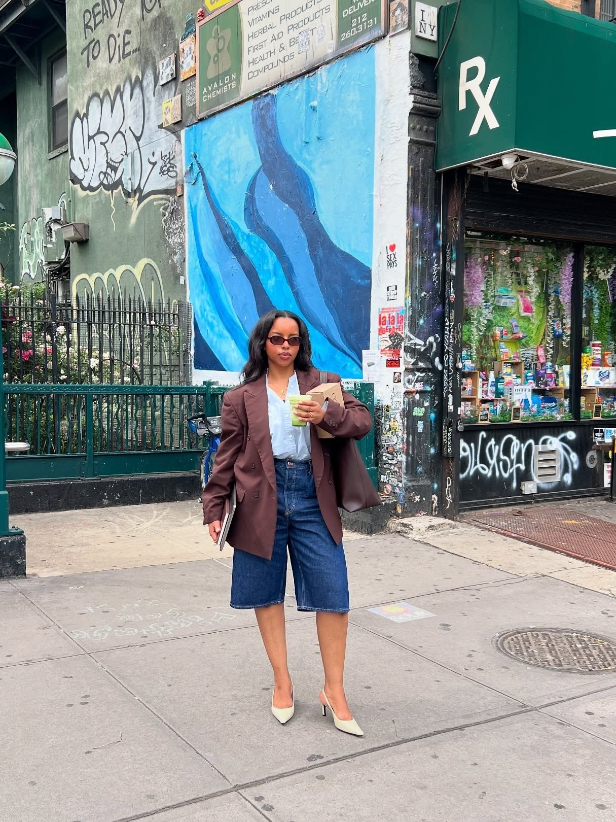 Influencer wearing long denim shorts with a blazer and pumps