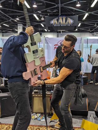 A puzzle piece guitar, demonstrated at Chibson's booth at the 2024 NAMM show