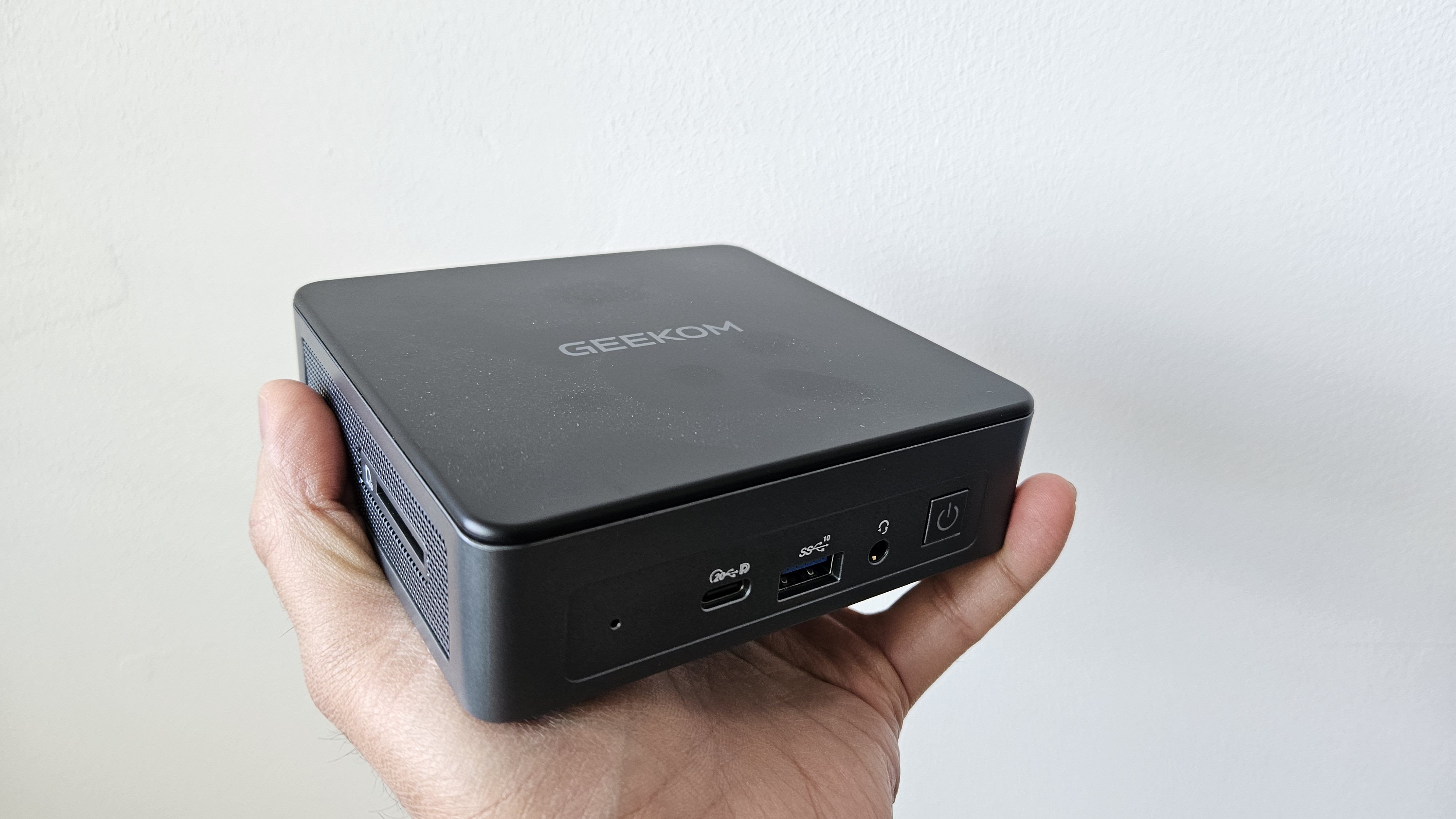 Our reviewer holding up the Geekom Air12 2026 Edition