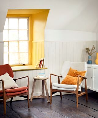 inside of window painted in a vibrant yellow contrasting with white walls in room