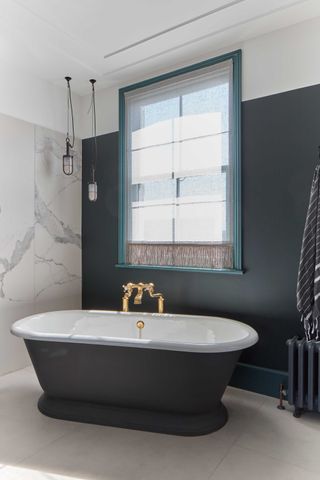 a bathroom with an accent wall
