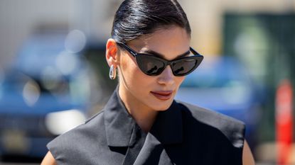 Guest at fashion week wearing shimmery lip gloss