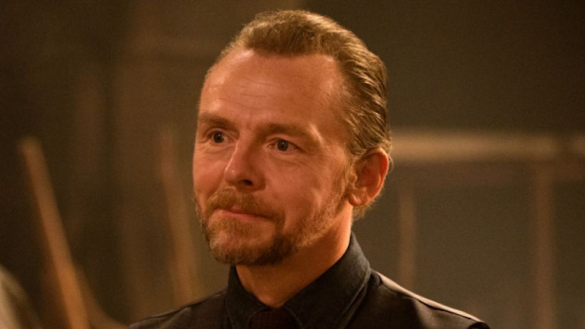 Simon Pegg looks on offscreen