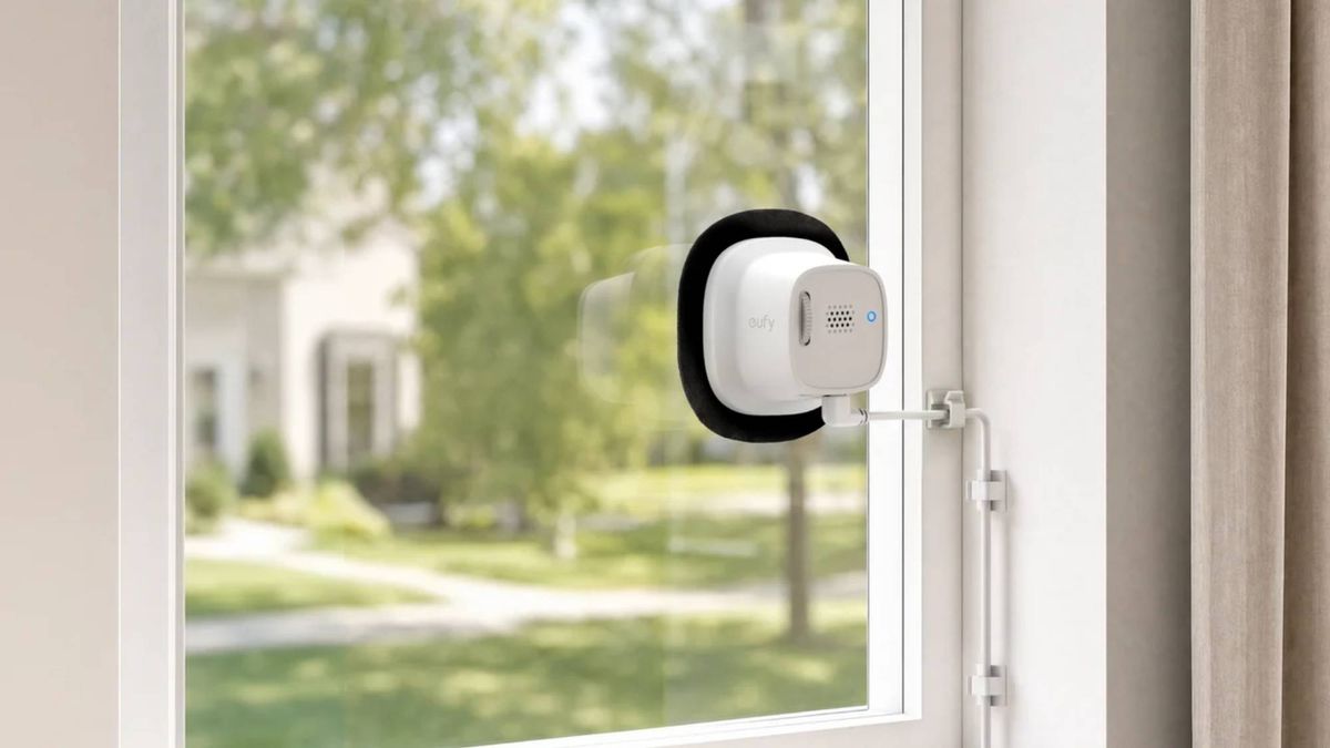 The Eufy E10 Window Camera stuck to a glass pane