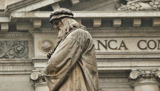 A statue of Leonardo da Vinci by Italian sculpture Pietro Magni in Milan's Piazza della Scala.