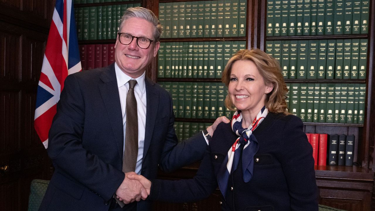 Opposition Labour Party leader Keir Starmer greets Natalie Elphicke, MP for Dover, after her defection from the Conservative Party, in the House of Commons