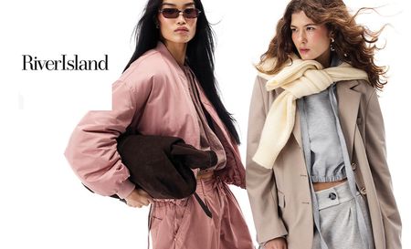 Two models posing with River Island clothes and accessories